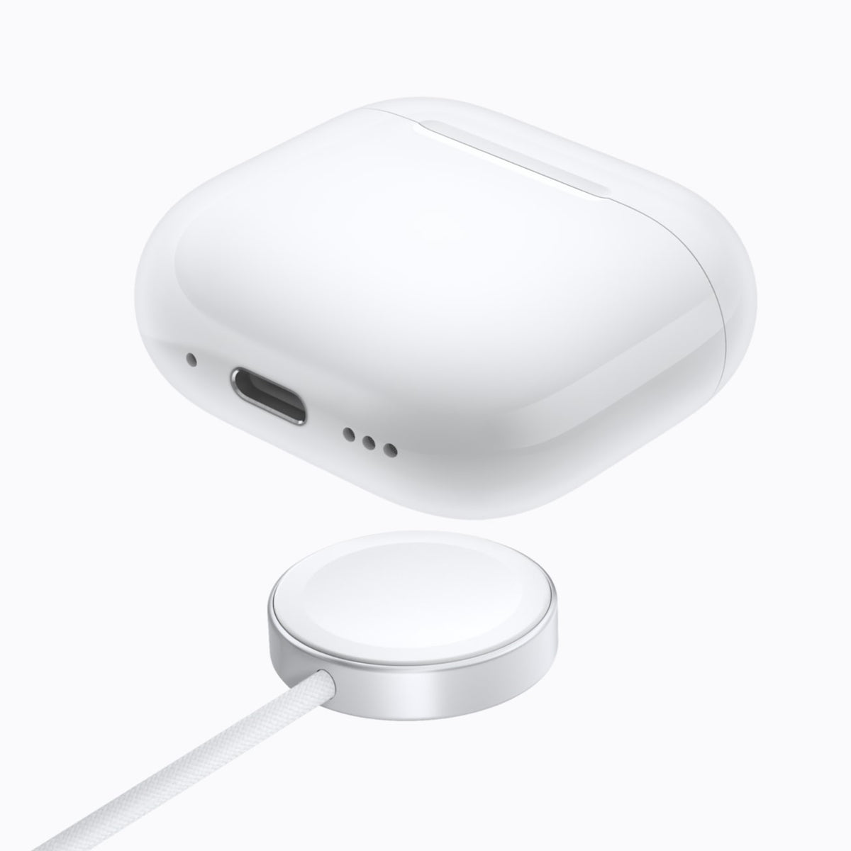 Estojo de Recarga Sem Fio dos AirPods 5 sobre carregador do Apple Watch (imagem de imprensa)